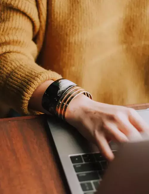 adult working on laptop