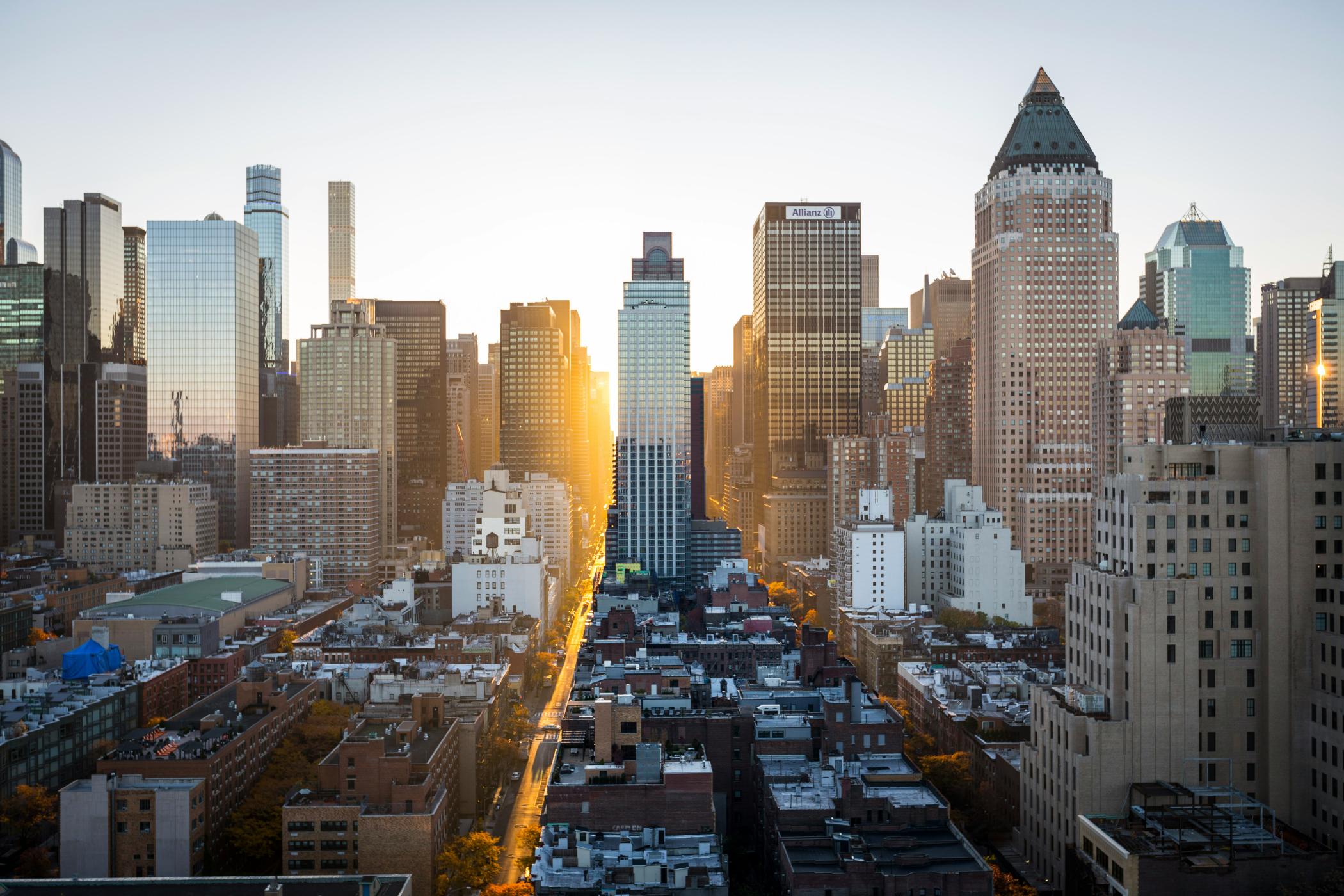 City buildings and rising sun 