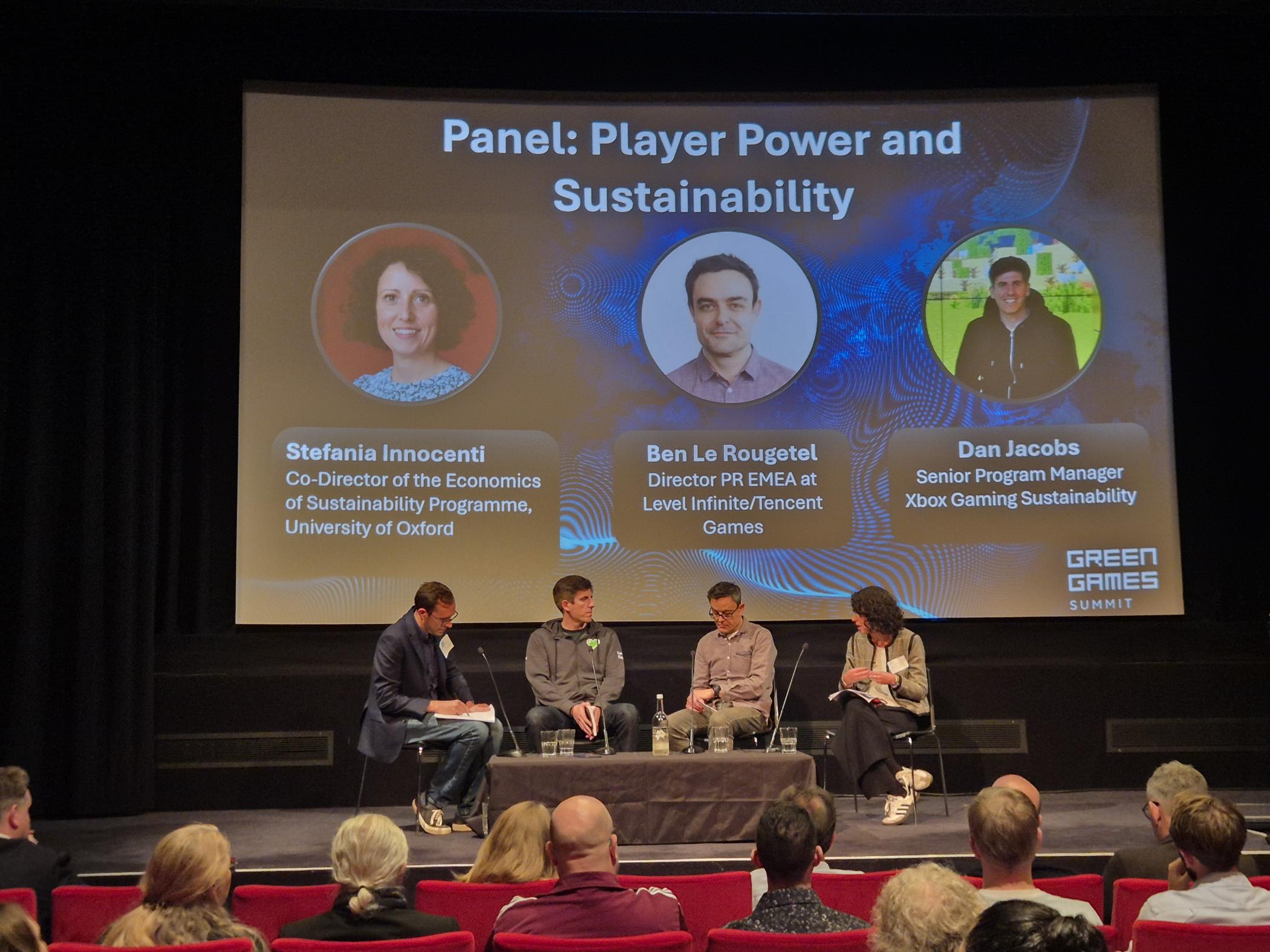 Group of people in discussion on a stage 